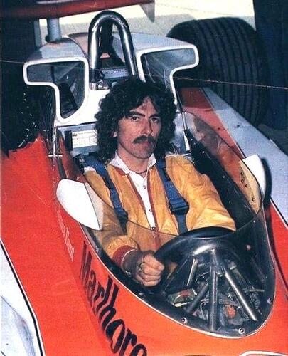George Harrison sitting in James Hunt's Mclaren M23 in 1979